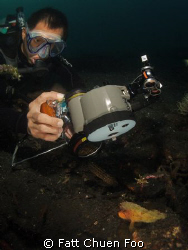 Edvin doing his macro thing, Lembeh, N Sulawesi by Fatt Chuen Foo 